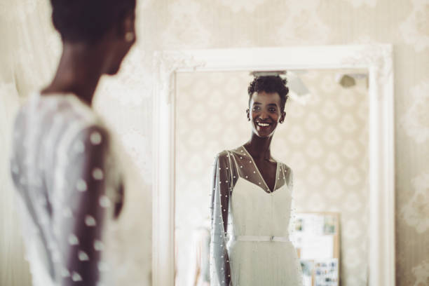 The bride is trying out her wedding dress