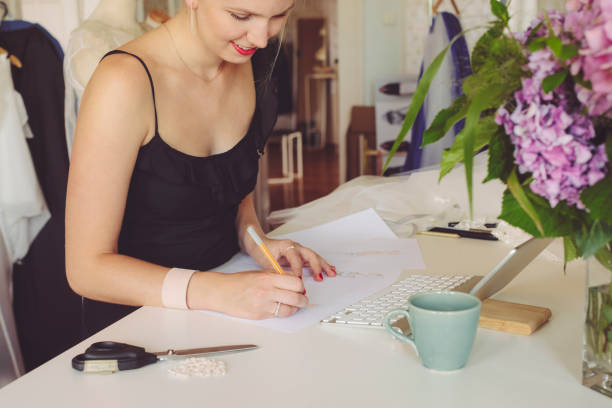 istock Fashion designer is making new sketches 1090913120