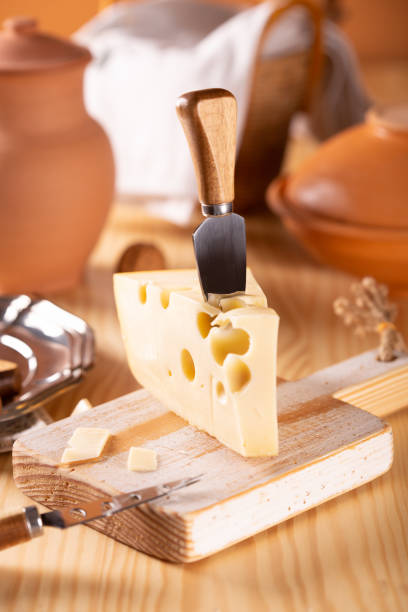 istock Piece of fresh tasty cheese on the kitchen table 1090918616
