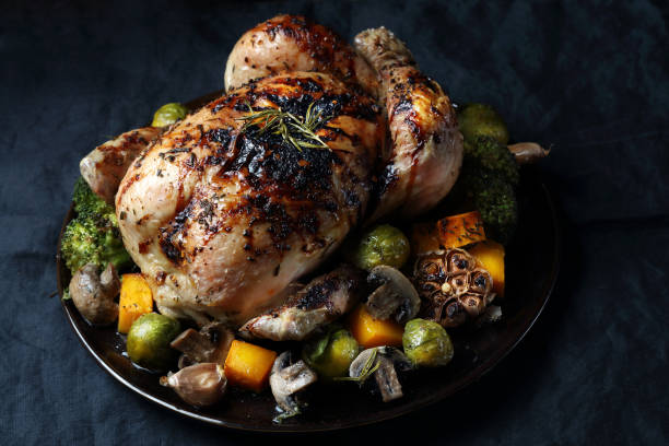 istock Whole baked chicken with mushrums and vegetables 1090921078