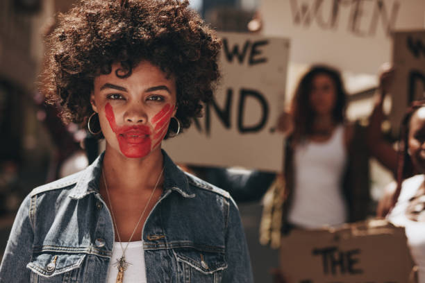 istock Activist demonstrating to stop women abuse 1090929806