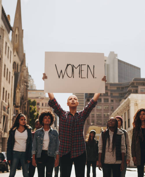 istock Group of women protesting on road 1090929890