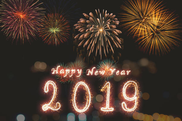 istock Happy new year 2019 written with Sparkle firework on fireworks with dark background, celebration and greeting cards concept 1090933774