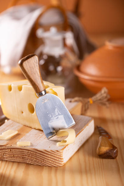 istock Piece of fresh tasty cheese on the kitchen table 1090933880