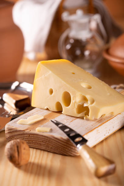 istock Piece of fresh tasty cheese on the kitchen table 1090933908