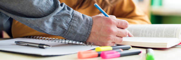 istock Young unrecognisable teacher helping his student in class. Education, Tutoring and Encouragement concept. 1090935294