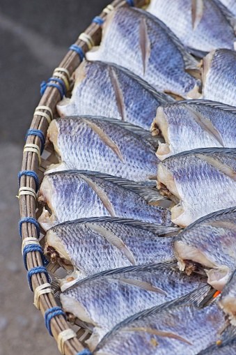 Closed up dried fish in basket (fresh market)