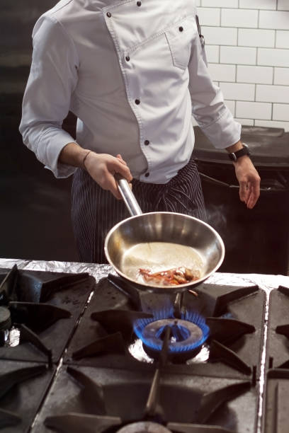 istock A man cooks cooking deep fryers in a kitchen fire. 1090940038