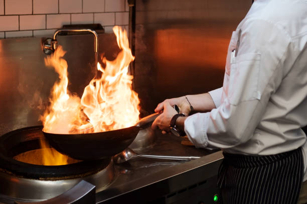 istock A man cooks cooking deep fryers in a kitchen fire. 1090941244