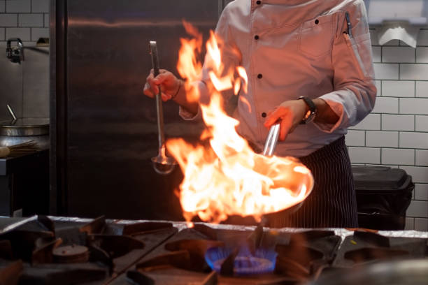 istock A man cooks cooking deep fryers in a kitchen fire. 1090941920
