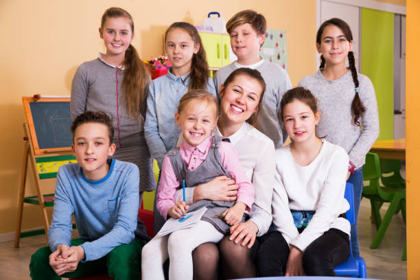 istock Kids with teacher in classroom 1090945302