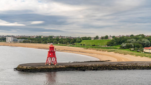 View from the River Tyne towards the Herd Groyne Lighthouse, with South Shields in the background