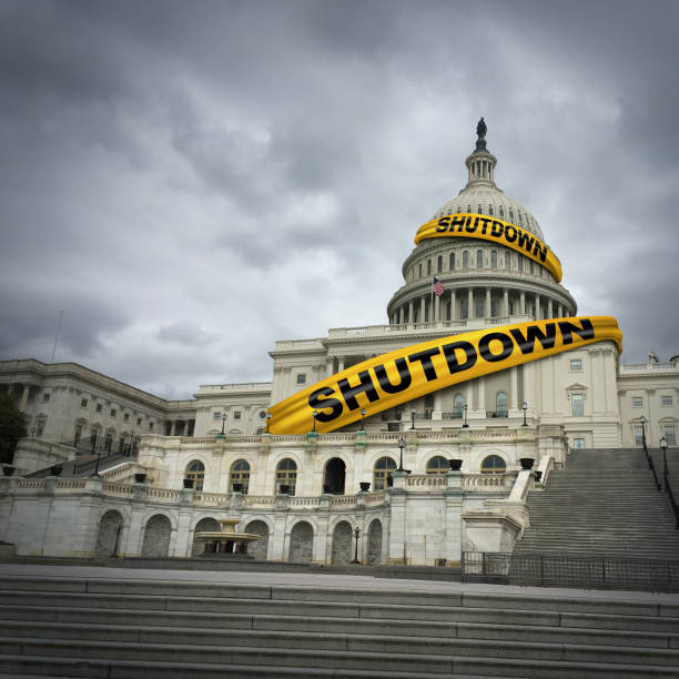 USA shutdown and United States government closed and american federal shut down due to spending bill disagreement between the left and the right pas a national finance symbol with yellow hazard tape in a 3D illustration style.