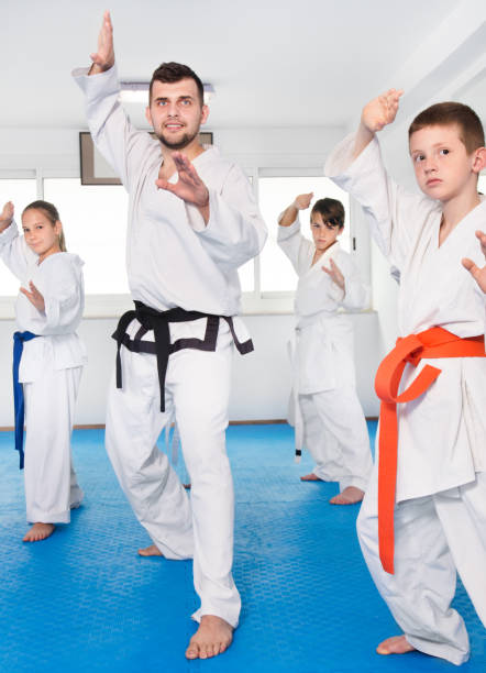 istock Children trying martial moves in karate class 1090951420
