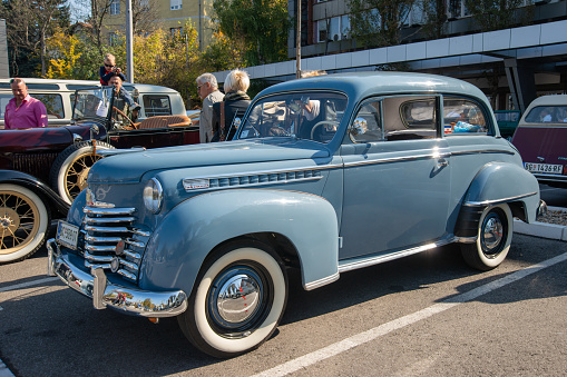 Belgrade, Serbia-October 13, 2018: An oldtimer exhibition in the parking lot in front of the Rakovica Municipality in Belgrade, Serbia. Opel a vintage limousine.
