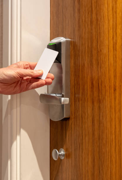istock Opening hotel room door with key card 1090957804