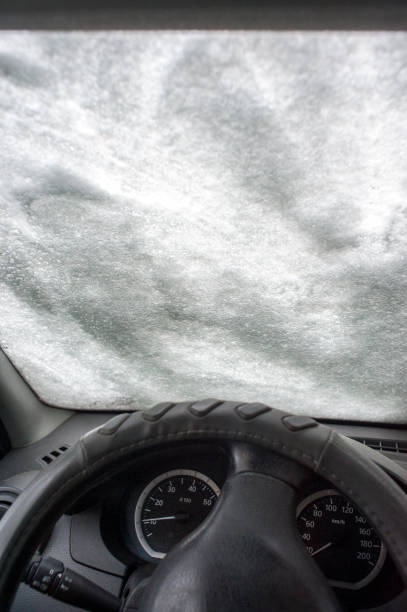 istock snow on windshield, snow cleaning, car in winter conditions 1090960208