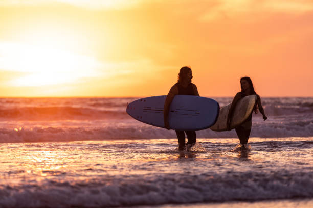 istock Couple surfing in California 1090961740