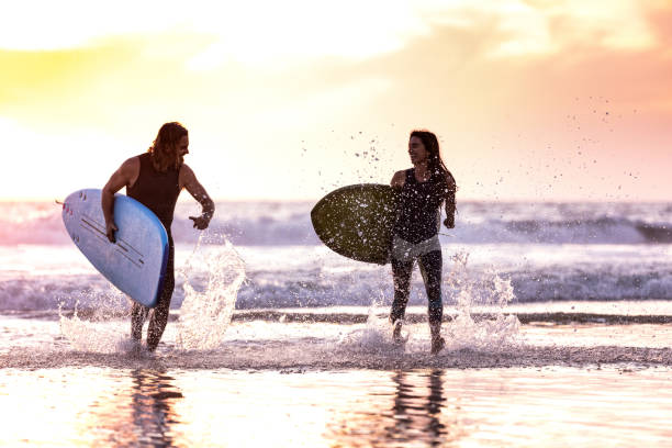 istock Couple surfing in California 1090961772