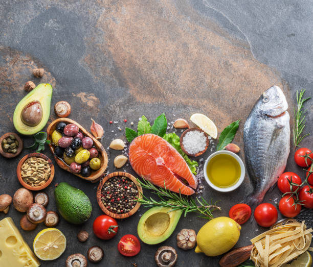 istock Raw dorado fish and salmon steak with spices and vegetables. 1090964134