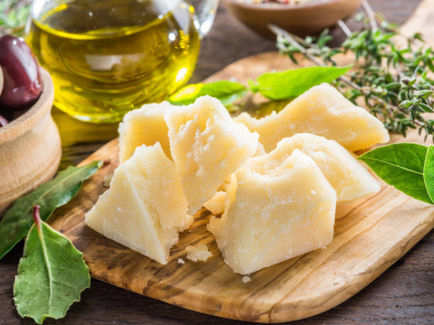 istock Parmesan cheese on wooden cutting board. 1090966420
