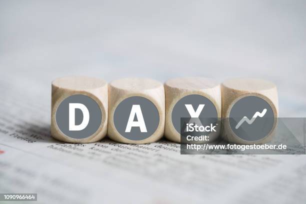 Cubes Forming The Acronym Dax On A Newspaper Stock Photo - Download Image Now - DAX - Stock Market Index, Alphabet, Stock Certificate