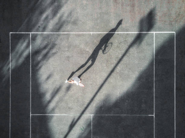 istock drone view over tennis player awaiting the service 1090966602