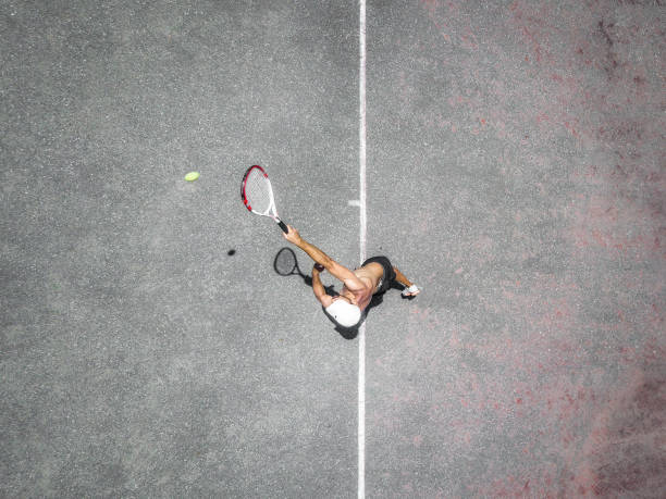 istock drone view over tennis player in action 1090966670