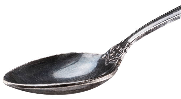 Old siver spoon close-up. Old siver spoon on white background close-up. File contains clipping path. baby spoon stock pictures, royalty-free photos & images