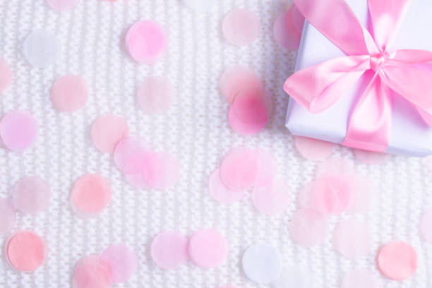 istock Beautiful gift box on white background with confetti. 1090969148