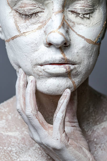 istock Beautiful woman with clay on face 1090975278