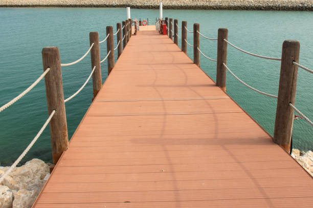 istock wooden port with rope on water 1090975724