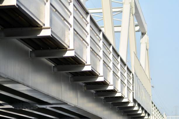 istock Fragment of metal train track bridge closeup bottom view 1090980698