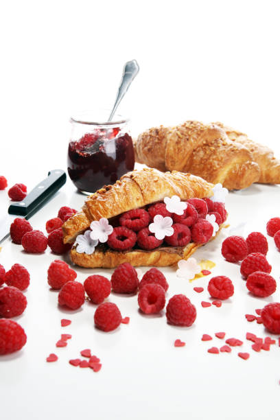 istock Delicious breakfast with fresh croissants and ripe berries 1090980700