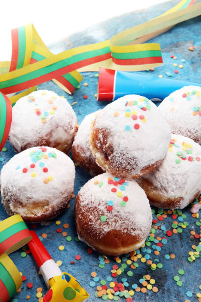 istock German donuts with jam and icing sugar. Carnival powdered sugar raised donuts 1090983578