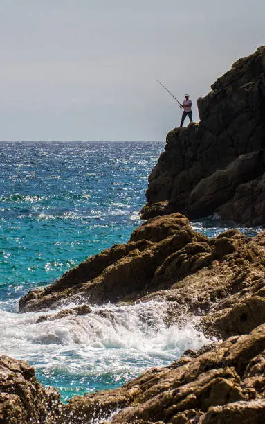 Photo of Sea Fisherman rod fishing from cliffs