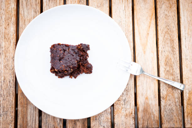 istock Flat lay of a vegan chocolate brownie with nuts 1090990584