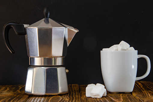 coffee composition - coffee maker, white cup of coffee and dessert