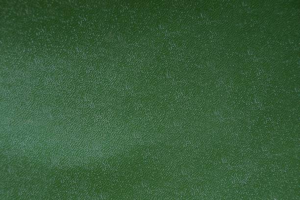 istock green background from old leather cover on the book 1090996966