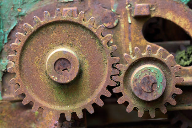 istock Old rusty gear overgrown with green moss from heavy industry machine 1091001896