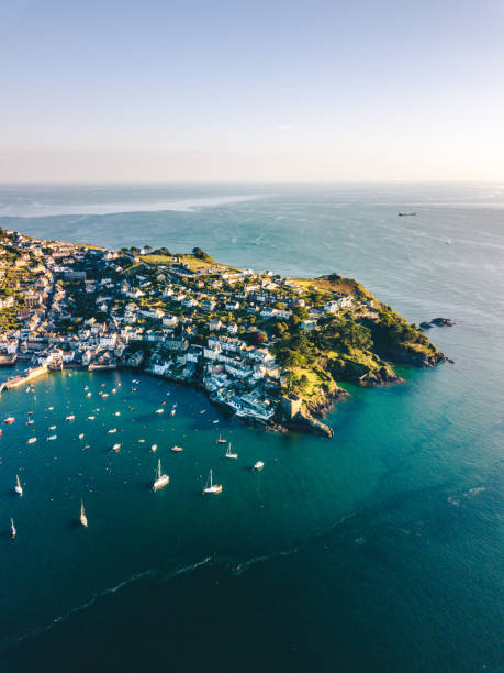 High over Fowey UK Aerial sunset view over Fowey cornwall england stock pictures, royalty-free photos & images