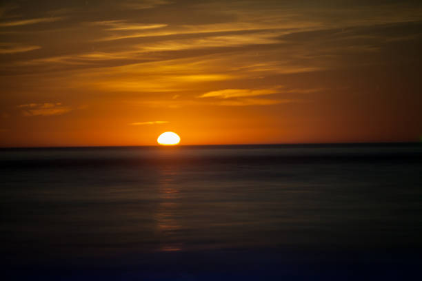 istock Red Moon Rising Above The Sea 1091008970