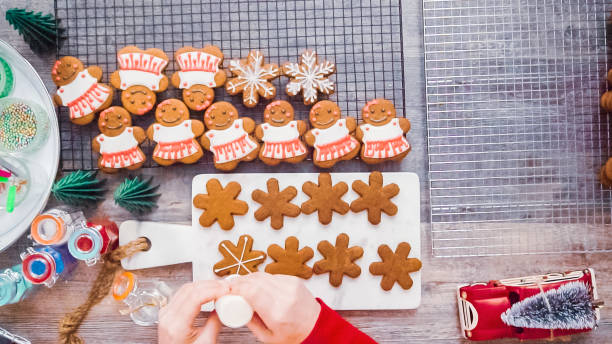 istock Decorating gingerbread cookies with royal icing. 1091019574