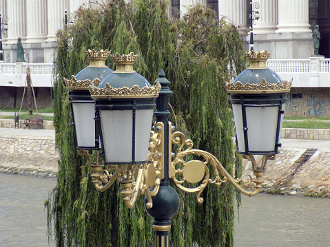 Retro styled street light in front of the weeping willow