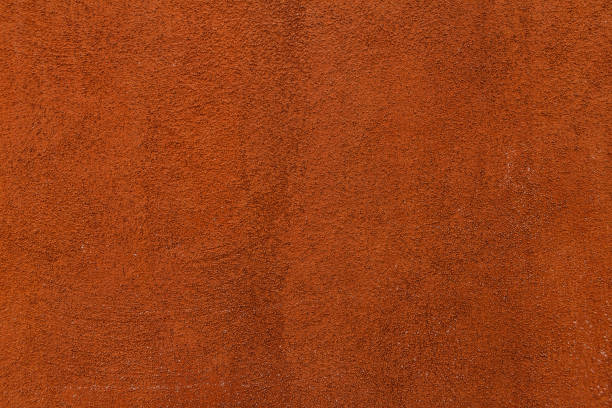 istock orange paint texture of old building wall 1091021478
