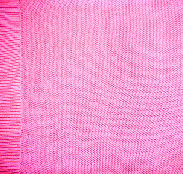 istock Pink blush purple magenta Knitted pattern wool sweater texture close up. Handmade pink purple magenta knitting wool texture background 1091030962