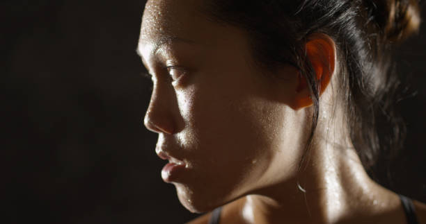 istock Healthy fit woman sweating taking a break from exercise 1091032530
