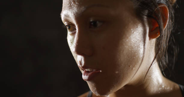 istock Close up of Athletic woman sweating taking a break after work out 1091032538
