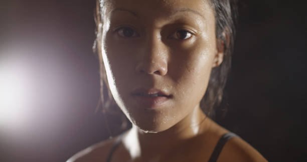istock Portrait of athletic woman sweating taking a break from workout 1091032556