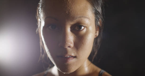 istock Portrait of athletic woman sweating taking a break from workout 1091032584